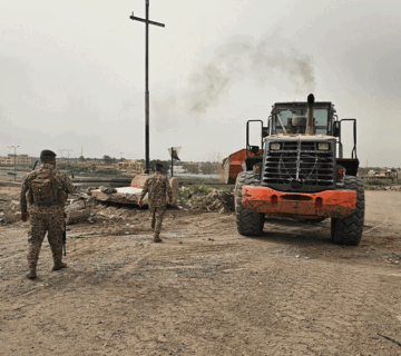 فتح طريق خدمي في قضاء أبي غريب
